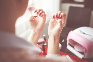 girl looking at her nails